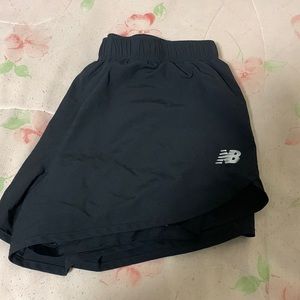 Size medium black New Balance shorts